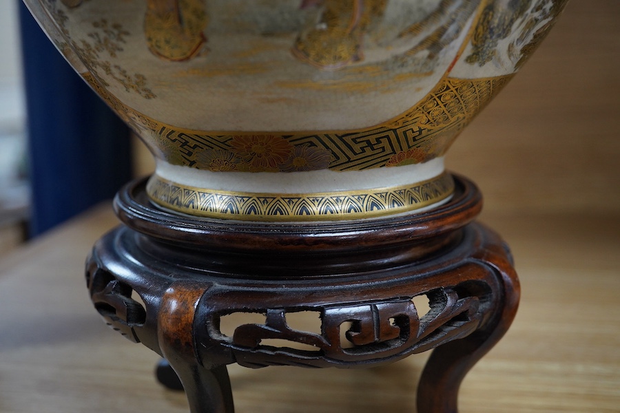 A Japanese Satsuma pottery vase decorated with figures and landscapes, signed Choshuzan to the base, 20cm high. Condition - good